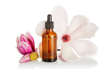 Plakat Magnolia flower oil isolated on white background. Skin care, spa, wellness, massage, aromatherapy and natural medicine