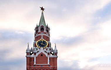 Moscow, Kremlin clock tower against the sky with clouds at sunset