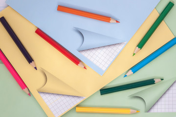 Colorful pencils on school notebook. Top view. Concept of education, starting school, back to school