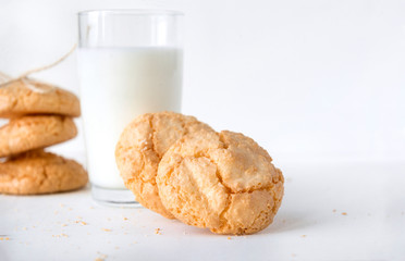 shortbread on white background, glass of milk
