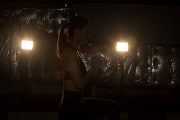 Asian slim Fitness woman exercise stretching legs arms boxing weight punch in Fog Smoke Dark...