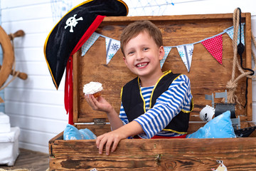boy in the form of pirates at the helm. holiday decoration pirate style
