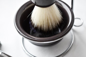 Shaving kit, shaving machine and foam brush. Shaving items. To shave a man. Shaving. Beard. Shave my hair. To remove the hair.