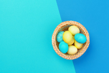 Candy color easter eggs over bright paper background
