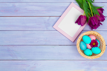 Easter background with tulips, eggs . Top view with copy space