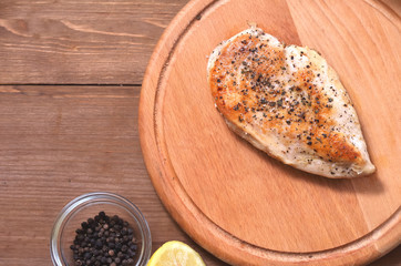 Grilled chicken fillet cooked in spices, sprinkled with salt