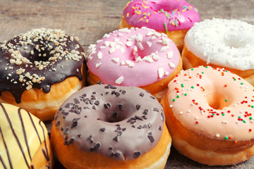 Glazed donuts on wooden background