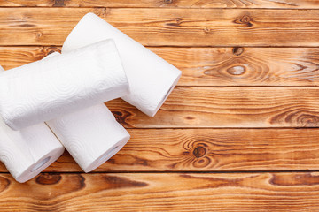 Roll of paper towel on wooden background