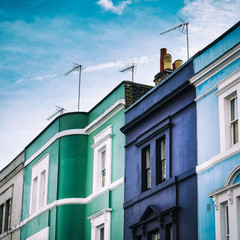 Fototapeta na wymiar Colorful typical London houses with blue sky in England