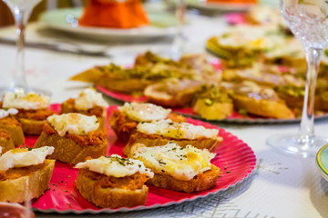 Typical spanish tapas, sobrasada sausage and fried quail eggs over a slice of bread