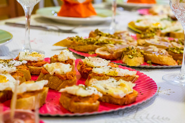 Typical spanish tapas, sobrasada sausage and fried quail eggs over a slice of bread