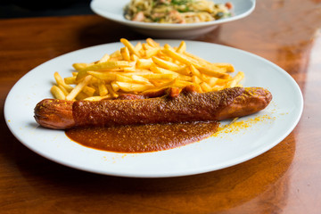 Grilled sausage served with french fries