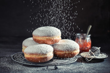 Delicious and sweet donuts with powdered sugar - obrazy, fototapety, plakaty