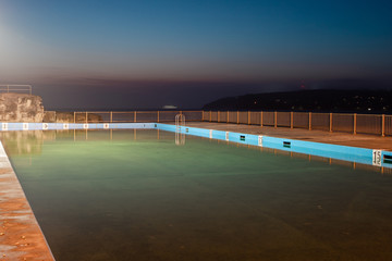 Empty Queenscliff rock pool at dawn.