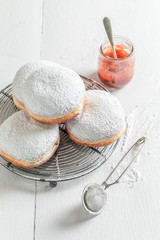 Sweet and brown donuts on cooling grate