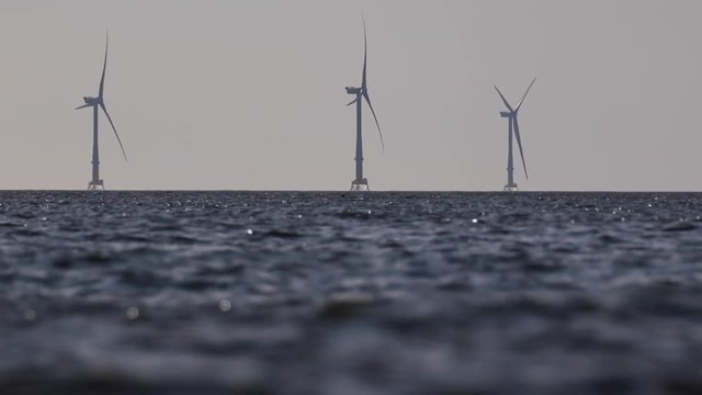 Windfarm offshore in aberdeenshire, Scotland during a calm day in winter.