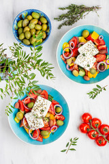 Greek salad with vegetables, feta cheese and olive oil