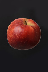 apple isolated on a black background.