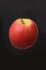 apple isolated on a black background.