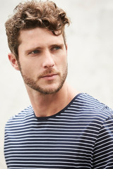 Fototapeta premium Bearded dude looking over shoulder with a serious expression