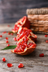 Pieces of ripe pomegranate on table