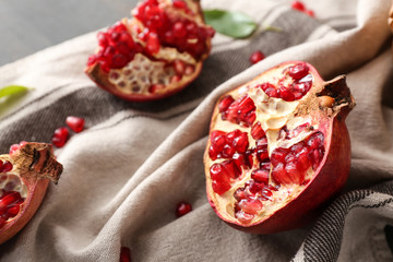 Ripe pomegranates on table
