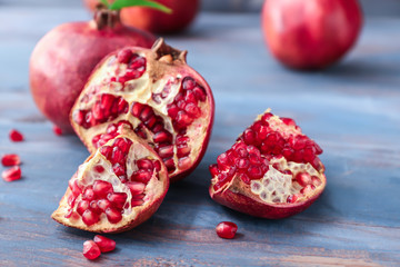 Ripe juicy pomegranates on table