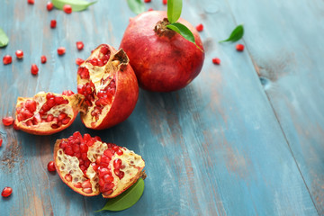 Ripe juicy pomegranates on table