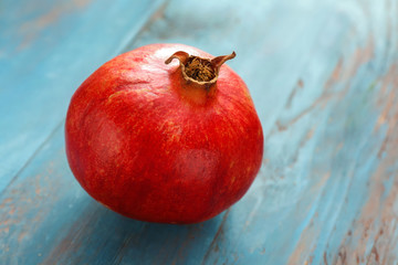 Ripe juicy pomegranate on table