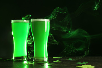 Glasses of green beer on table. Saint Patrick's Day celebration