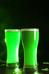 Glasses of green beer on table. Saint Patrick's Day celebration