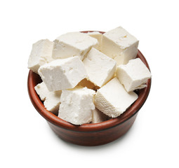 Bowl with tasty feta cheese on white background