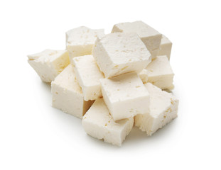 Pieces of tasty feta cheese on white background