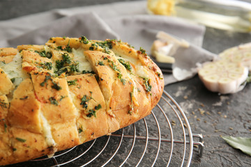 Tasty garlic bread on table, closeup