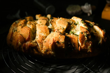 Tasty garlic bread on table
