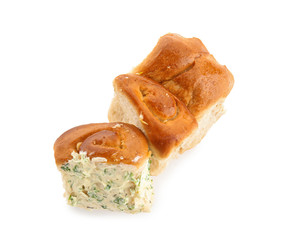Buns with tasty garlic spreading on white background