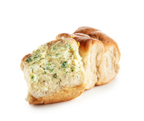 Buns with tasty garlic spreading on white background