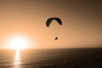 Paragliding At Sunset