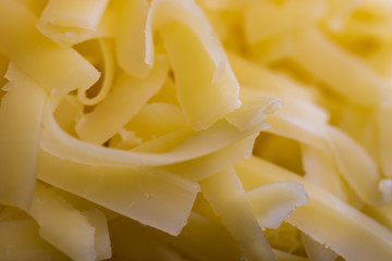 Close up of grated cheddar cheese.