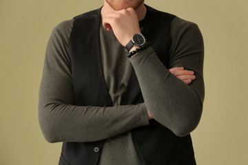 Fashionable young man on color background, closeup