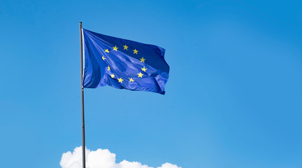 EU european flag flying against a clear blue sky