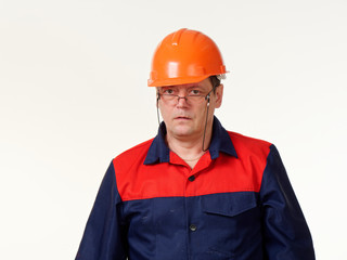 man in builder overalls on white background.