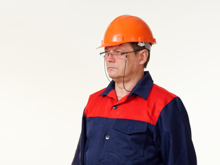 man in builder overalls on white background.