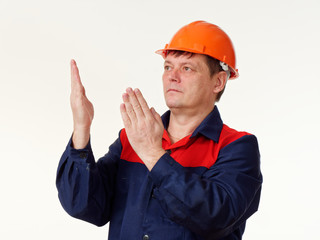 man in builder overalls on white background.