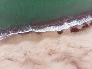 Curonian Spit and the Baltic Sea. View from the copter. Coastline with the beach and the sea. Nature conservation. View from the sky. The photo was taken by drone quadcopter.