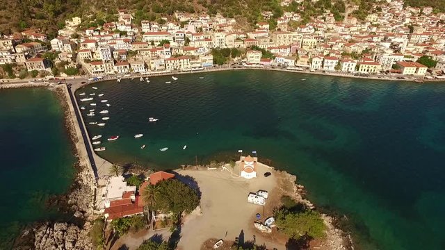 Aerial drone video of famous small islet of Kranai known for old lighthouse and tower of Tzannetakis, Gytheio, Lakonia, Peloponnese, Greece