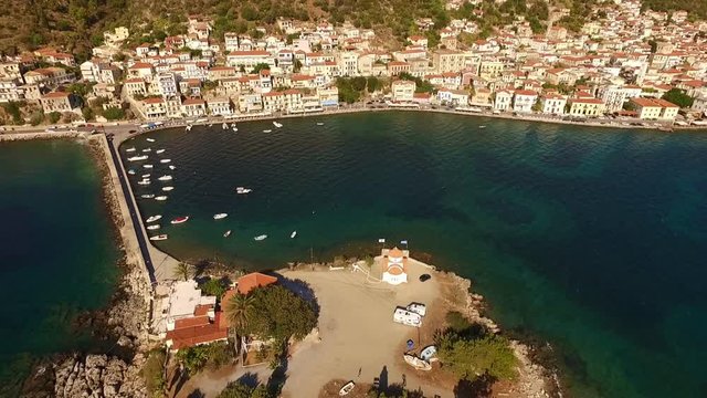 Aerial drone video of famous small islet of Kranai known for old lighthouse and tower of Tzannetakis, Gytheio, Lakonia, Peloponnese, Greece