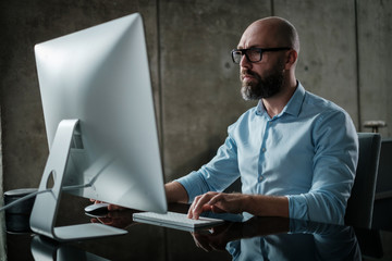 Middle-aged designer working in office
