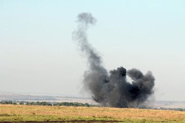 The explosion of a combat charge at the site during the battle, military action, the conflict between Ukraine and Donbass