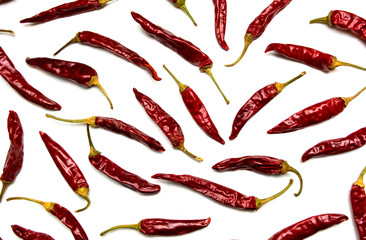 Dried red peppers on white background